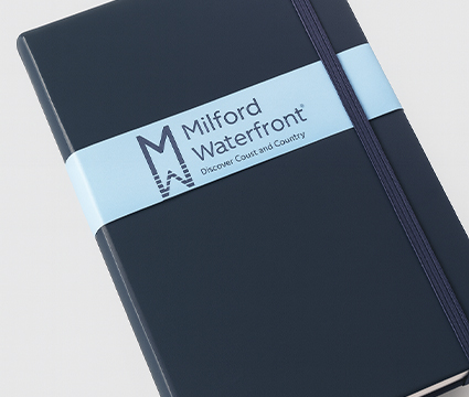 Notebook with a custom printed belly band