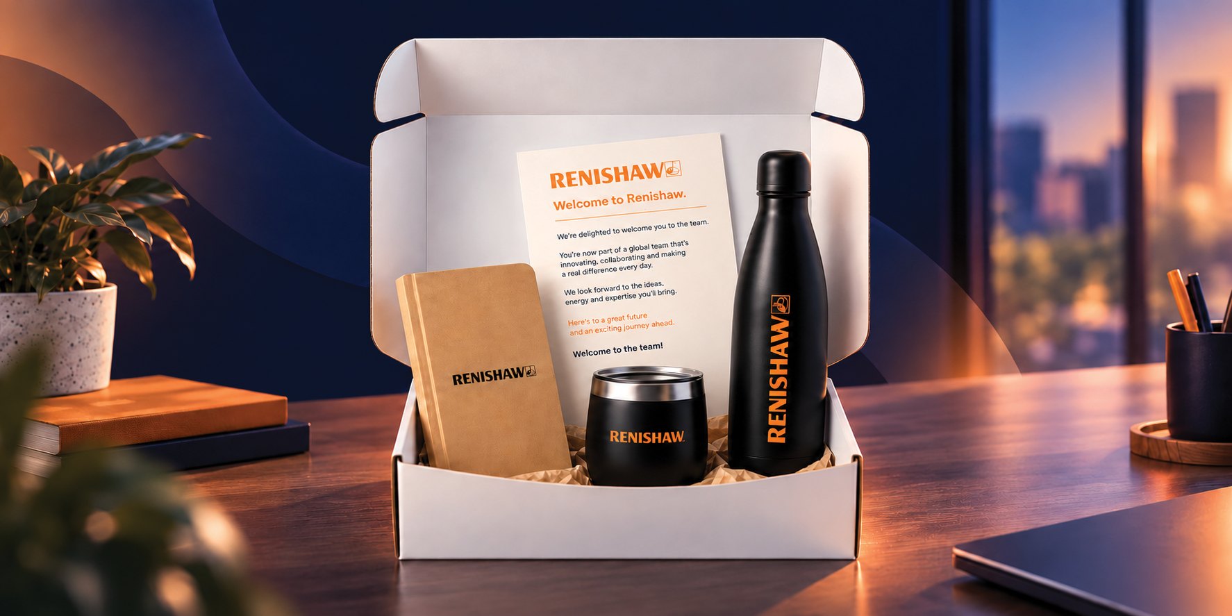 Renishaw branded onboarding box with notebook, insulated tumbler and water bottle