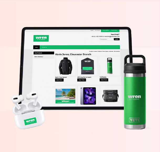 Branded corporate webshop shown on a tablet with earbuds and drinks bottle