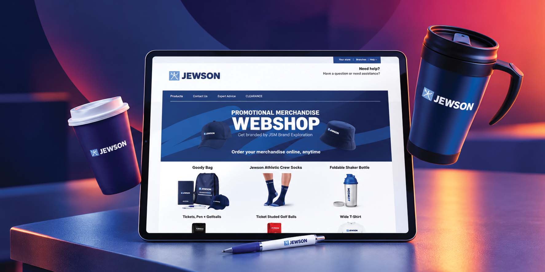 The Jewson branded merchandise webshop shown on a tablet beside branded drinkware